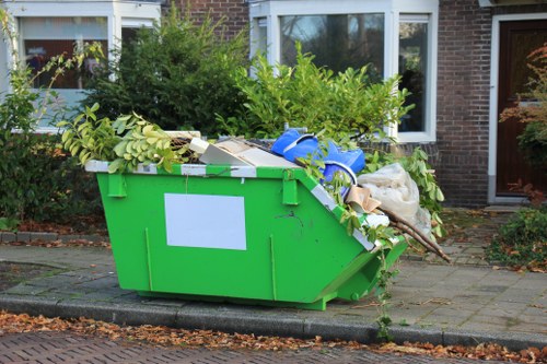 Sorted recycling bins and labelled waste streams at an office clearance site
